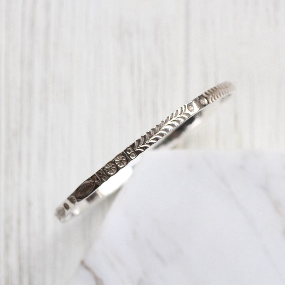 
                      
                        BRC Stamped Fish and Fern Bangle
                      
                    