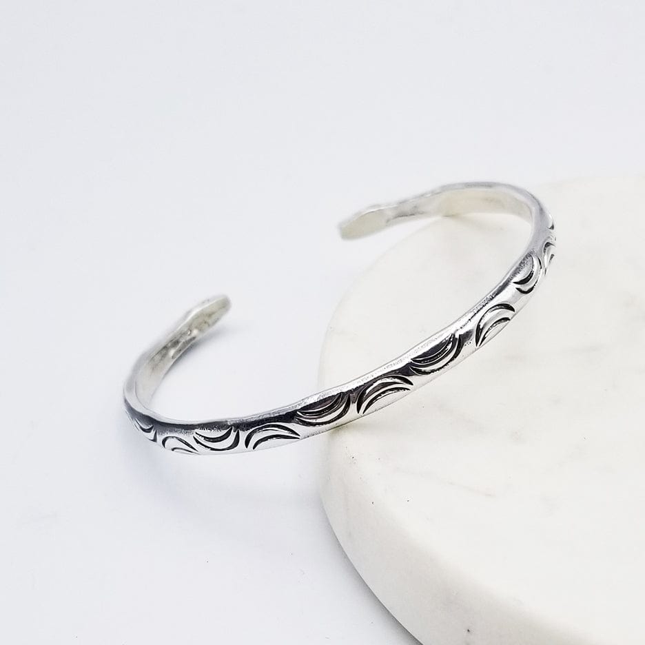 
                  
                    BRC STAMPED MOONS CUFF WITH SNAKE HEAD ENDS
                  
                