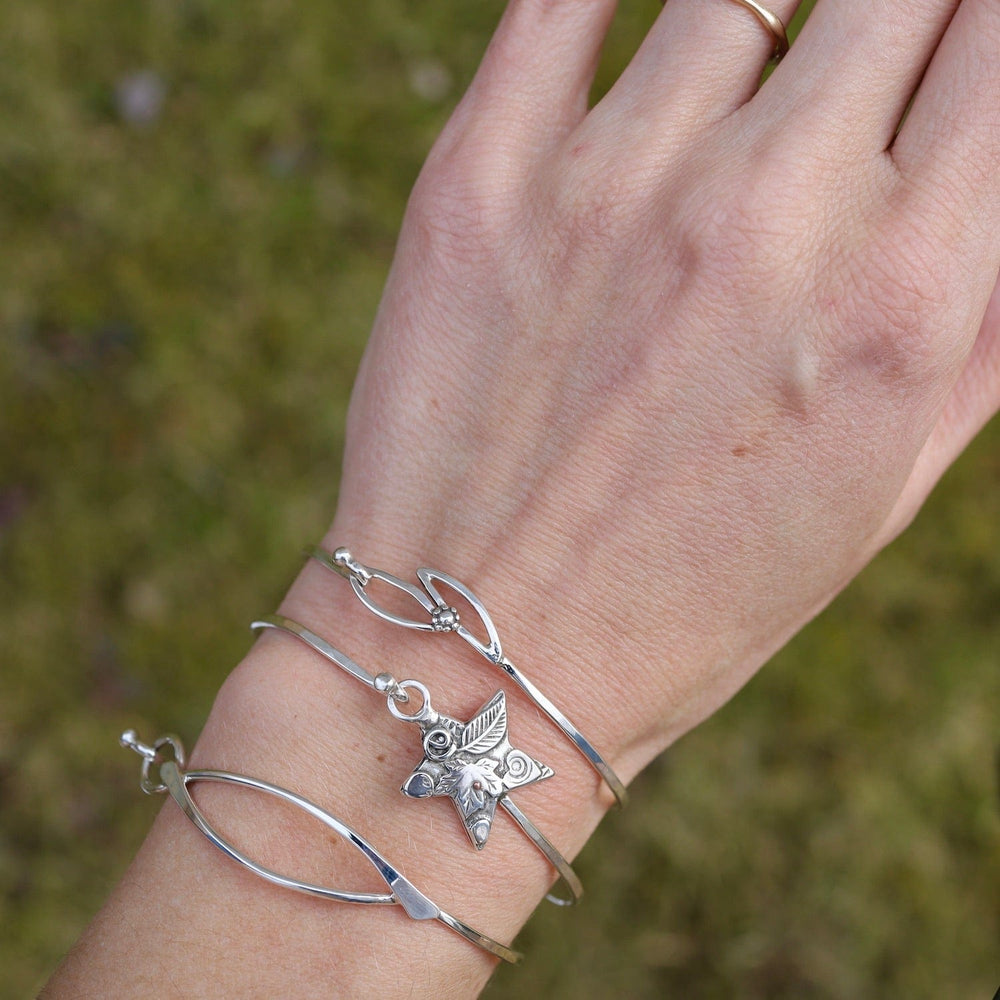 
                  
                    BRC Sterling Silver Bangle with Leafy Star Catch
                  
                