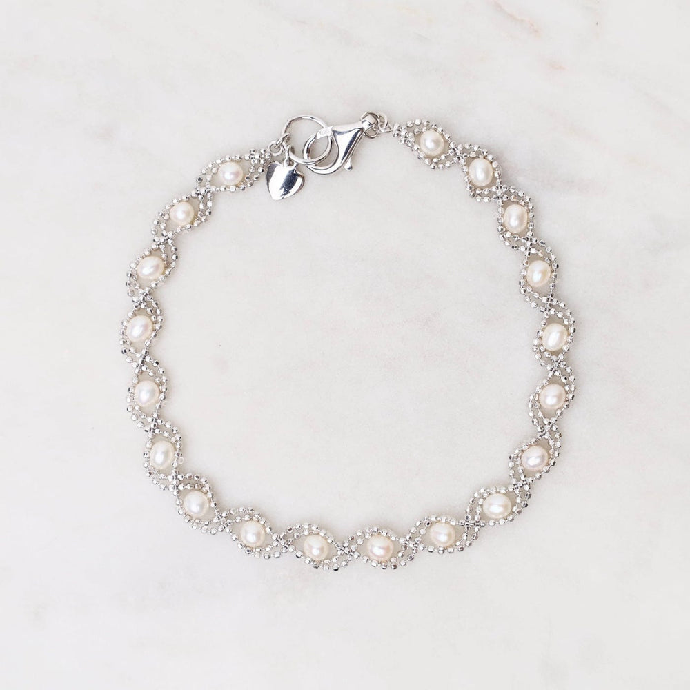 
                      
                        BRC Sterling Silver Captured Pearl Bracelet
                      
                    