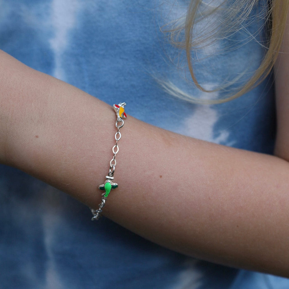 
                      
                        BRC Sterling Silver Child's Bracelet with Enamel Planes
                      
                    