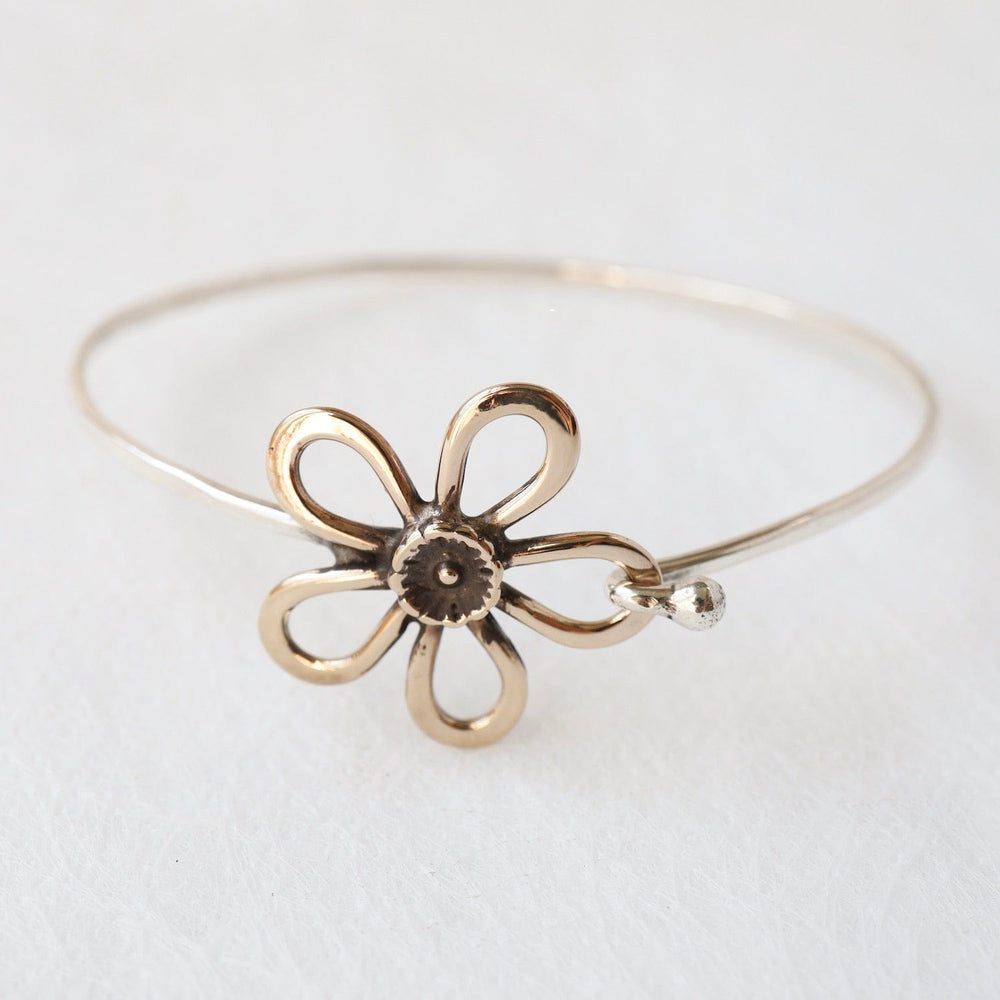 
                  
                    BRC Sterling Silver Clasp Bracelet with Brass Five Petal Daisy
                  
                