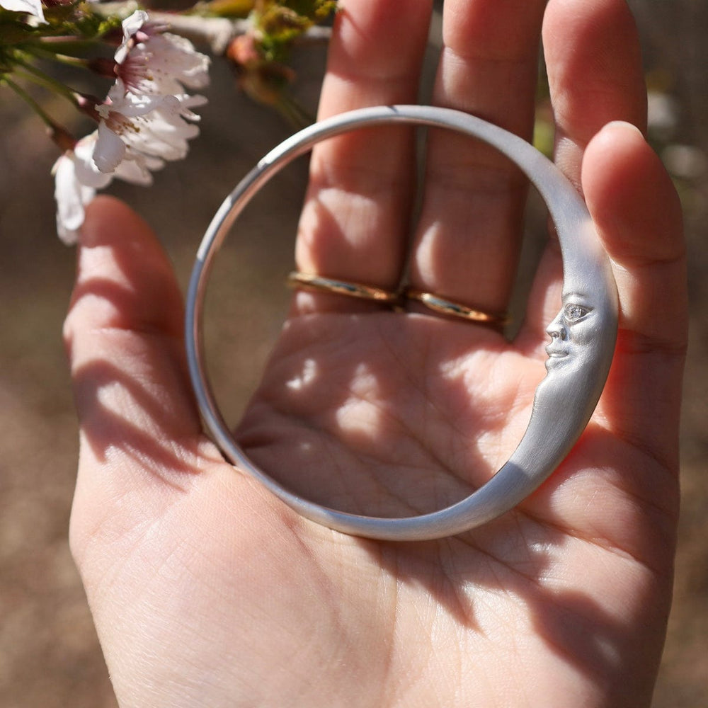 
                      
                        BRC Sterling Silver Crescent Moonface Bangle
                      
                    