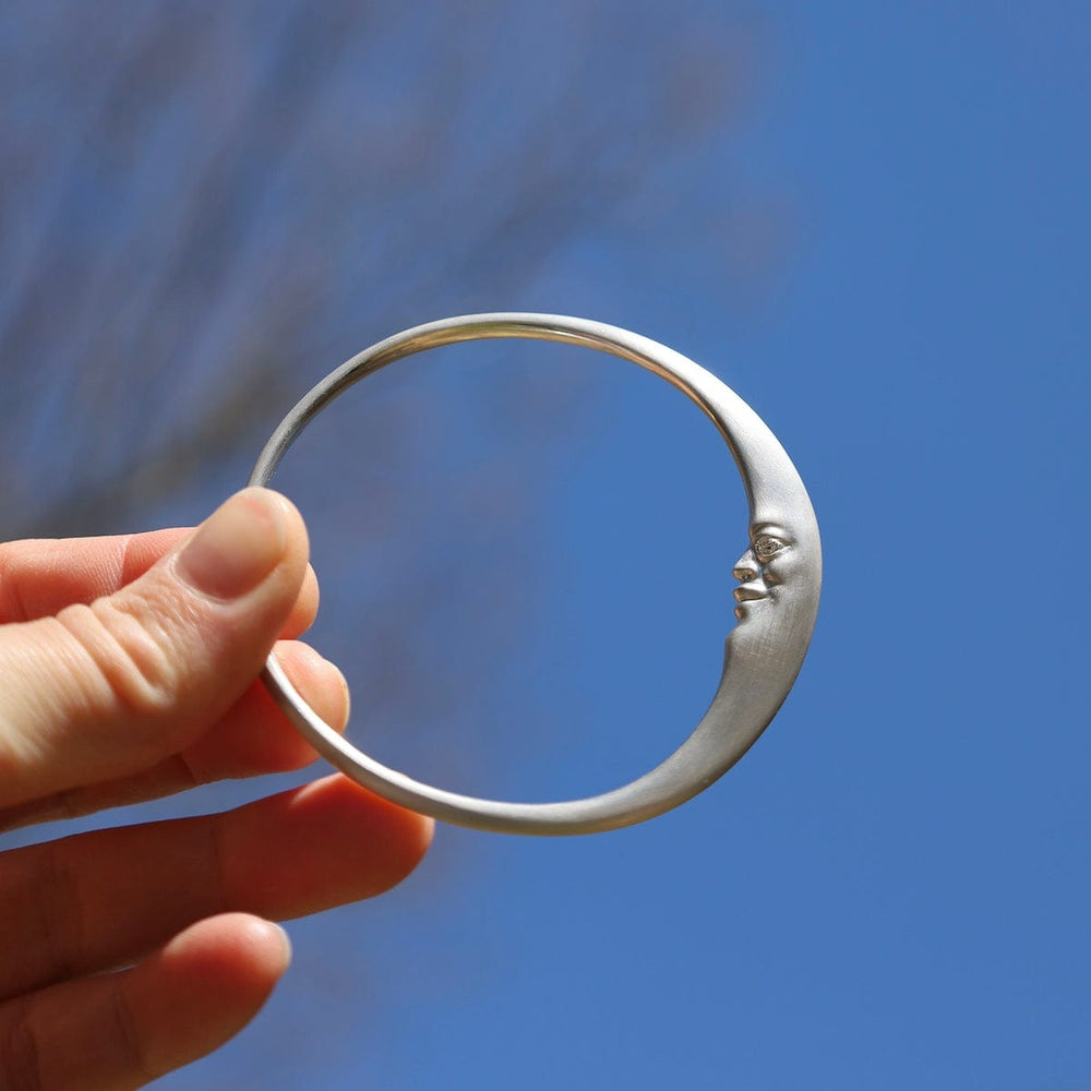 
                      
                        BRC Sterling Silver Crescent Moonface Bangle
                      
                    