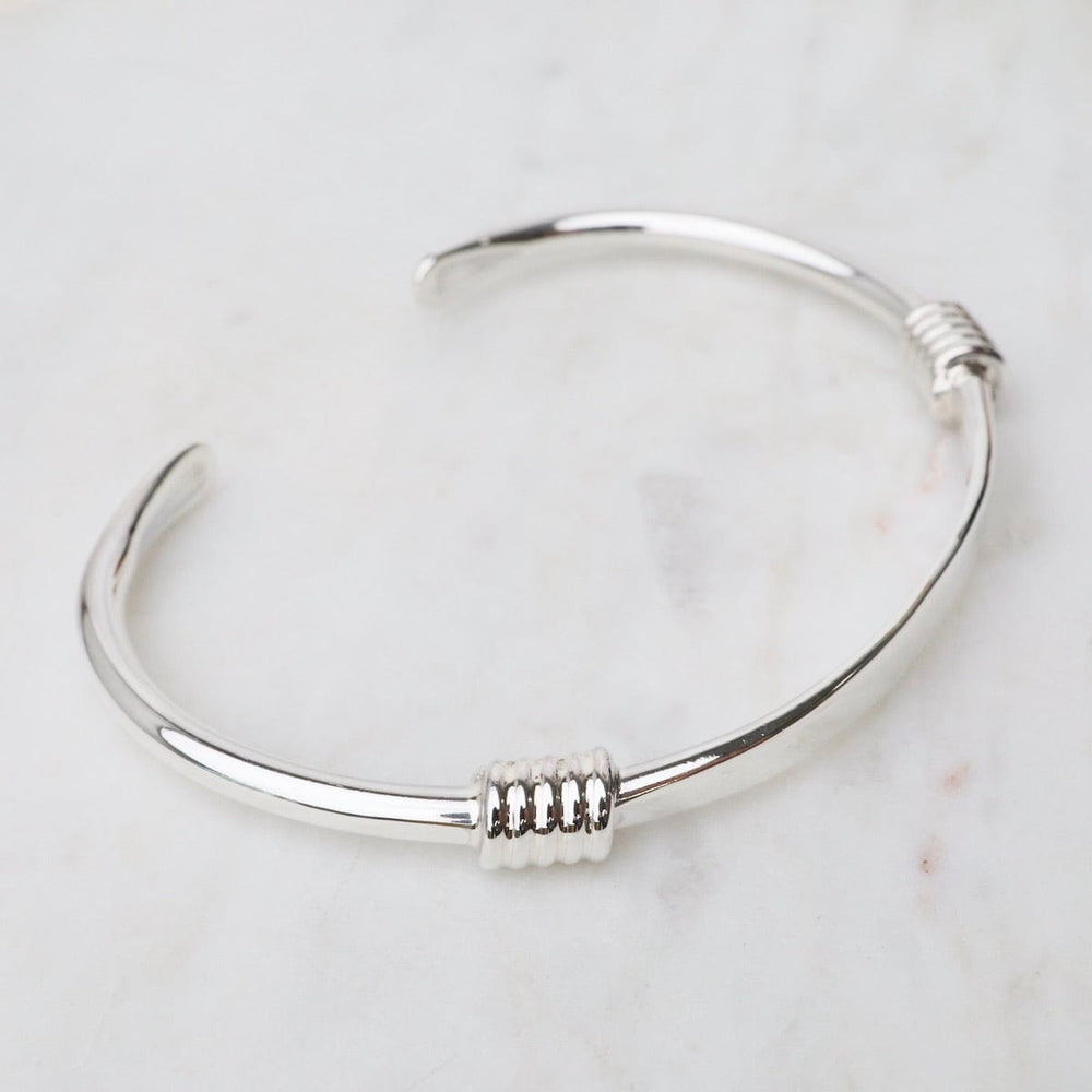 
                  
                    BRC Sterling Silver Cuff with Double Wrapped Details
                  
                