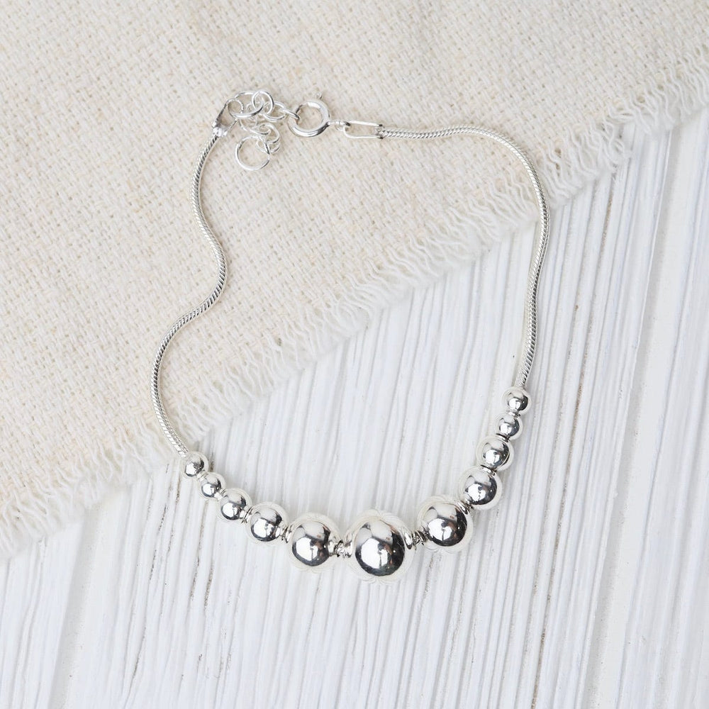 
                      
                        BRC Sterling Silver Snake Chain with Graduating Balls Bracelet
                      
                    