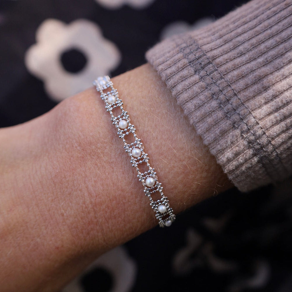 
                      
                        BRC Sterling Silver Woven Ladder Pearl Bracelet
                      
                    