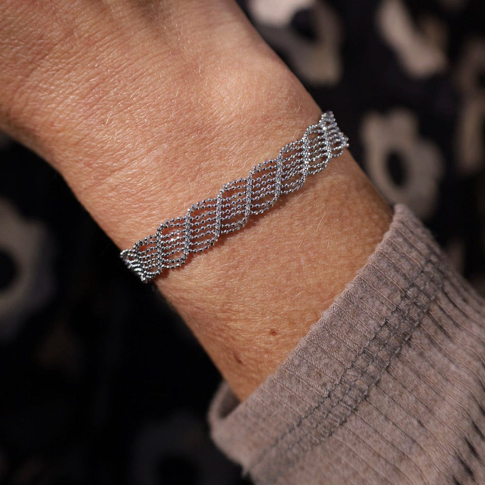 
                      
                        BRC Sterling Silver Woven Open Twist Bracelet
                      
                    