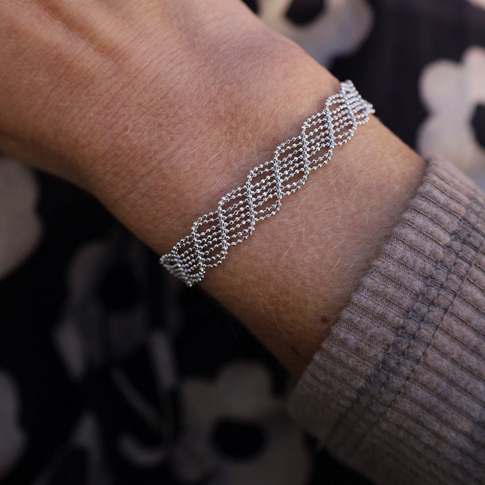 
                      
                        BRC Sterling Silver Woven Open Twist Bracelet
                      
                    