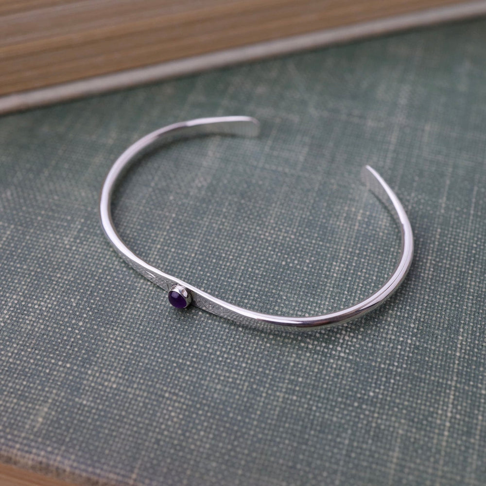 
                      
                        BRC Thin Etched Cuff with Amethyst Cabochon
                      
                    