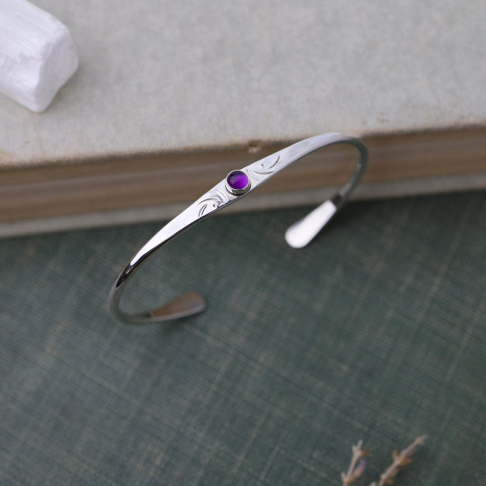 
                      
                        BRC Thin Etched Cuff with Amethyst Cabochon
                      
                    