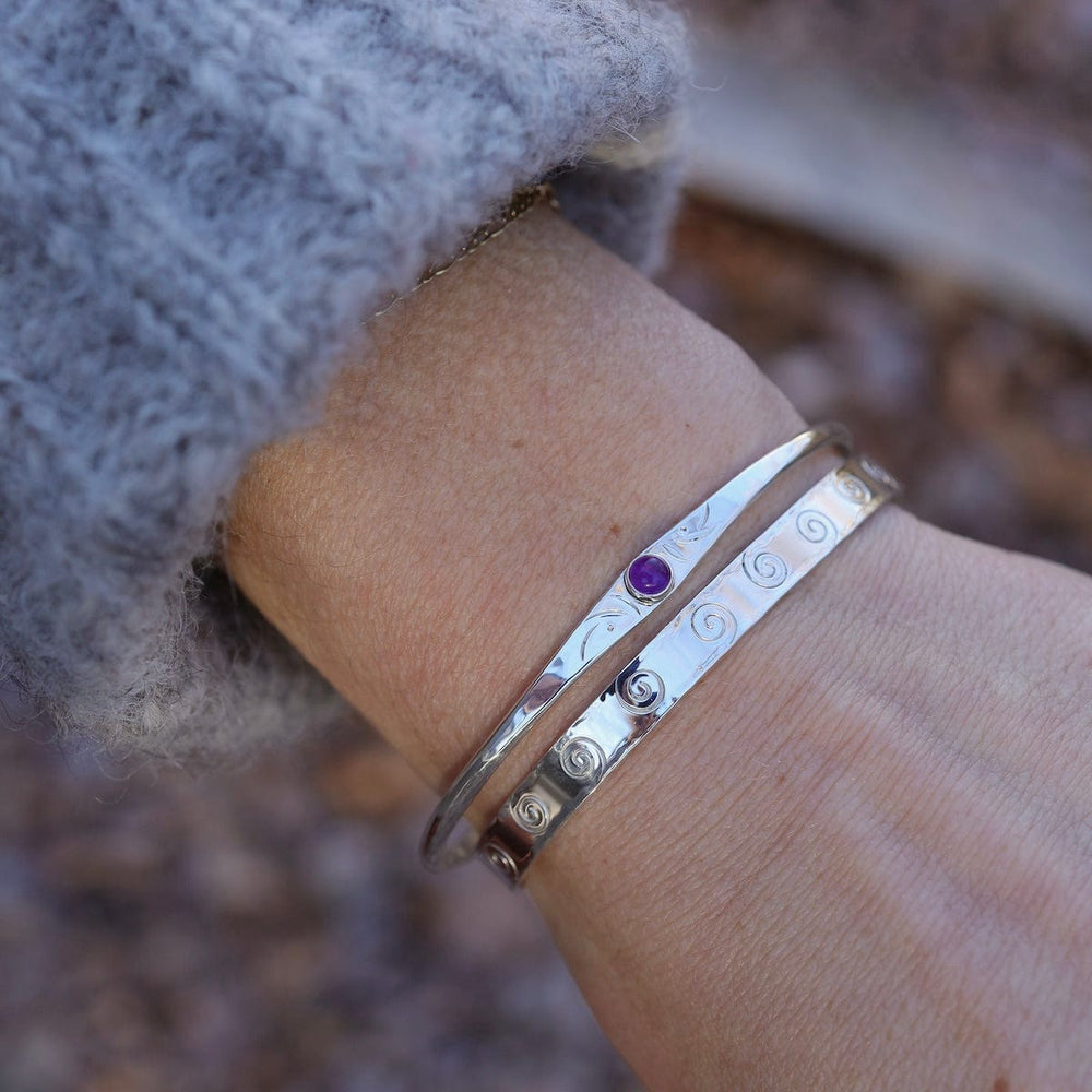 
                      
                        BRC Thin Etched Cuff with Amethyst Cabochon
                      
                    