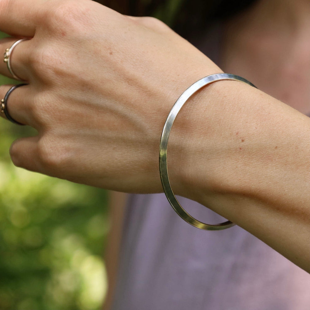 
                  
                    BRC Thin Triangle Bangle in Oxidized Silver
                  
                