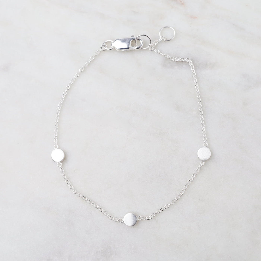 
                      
                        BRC Three Dots Bracelet in Brushed Sterling Silver
                      
                    