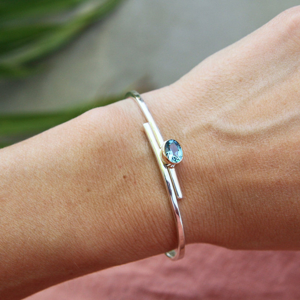 BRC Urban Swing Bracelet in Sterling Silver, 14k Gold, & Blue Topaz