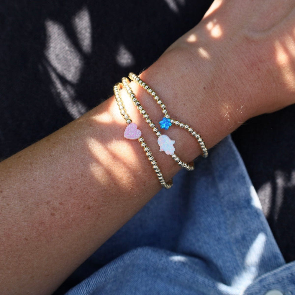 
                  
                    BRC White Opal Hamsa Gold Filled Ball Bracelet
                  
                