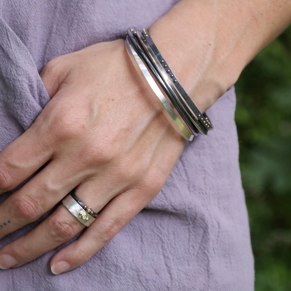 
                  
                    BRC Wide Triangle Bangle in Polished Silver
                  
                