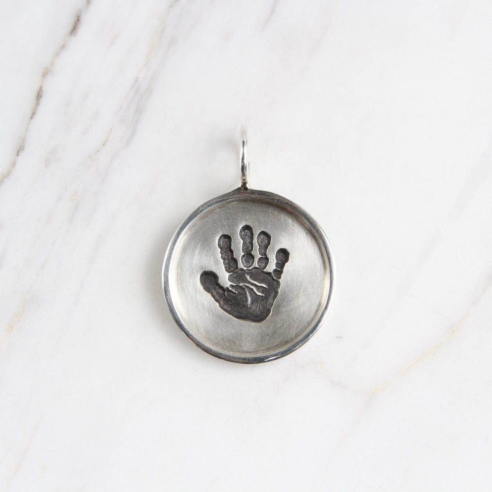 
                  
                    CHM Handprint Small Silver Round Disc with Silver Frame Charm
                  
                