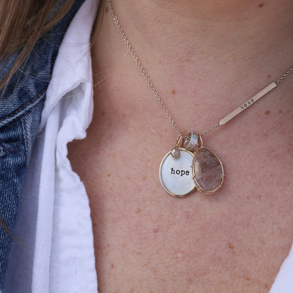 
                  
                    CHM "hope" Sterling Silver and 14K Gold Charm
                  
                