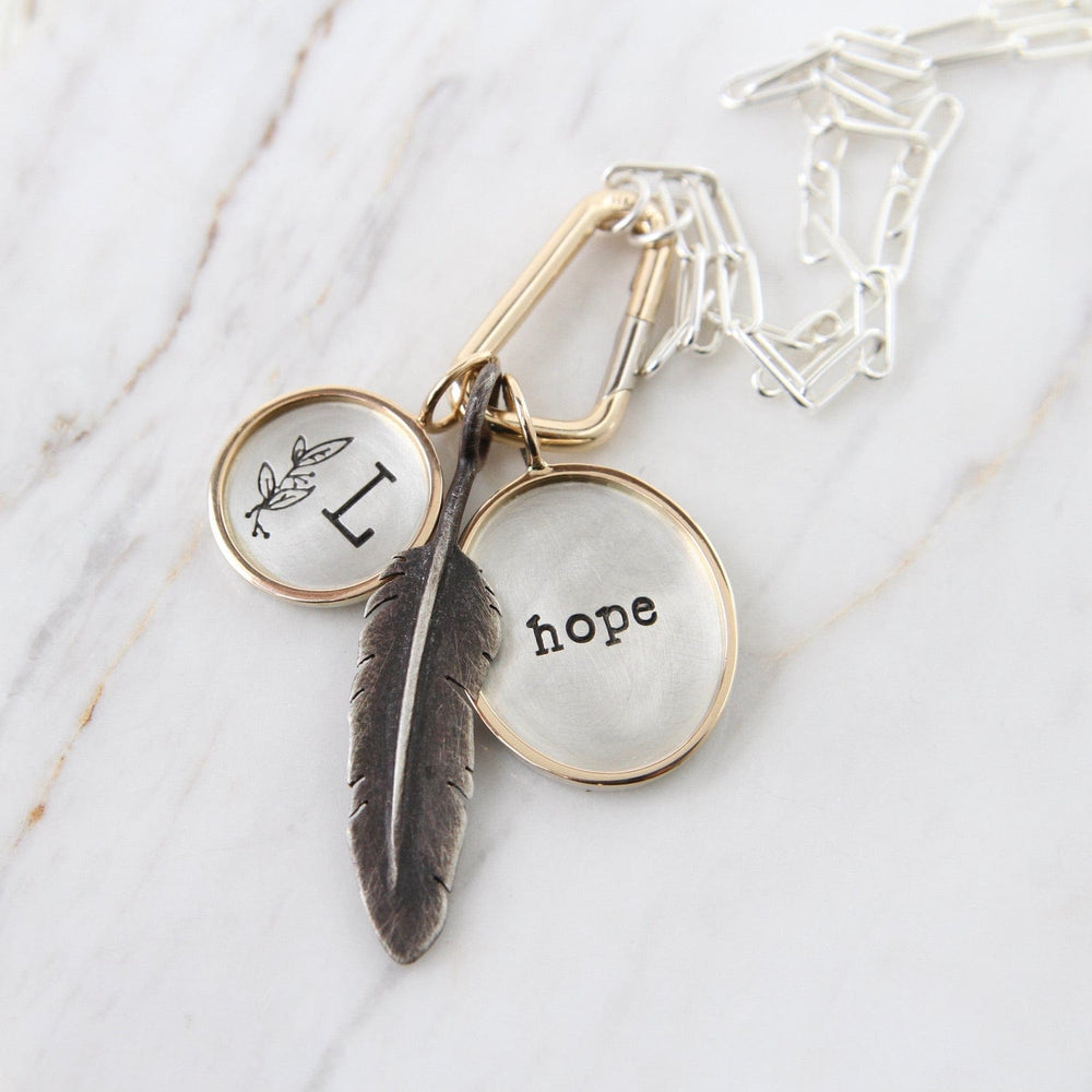 
                  
                    CHM "hope" Sterling Silver and 14K Gold Charm
                  
                