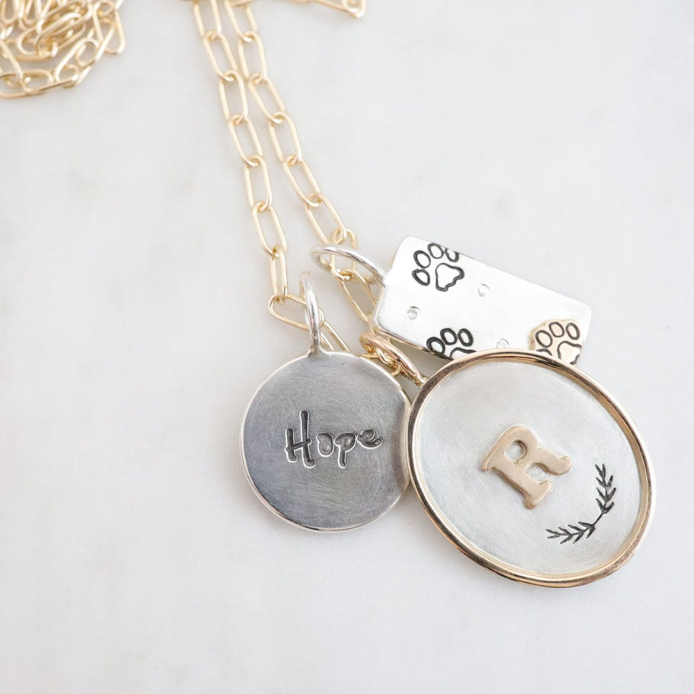 
                  
                    CHM Round Hope Charm
                  
                