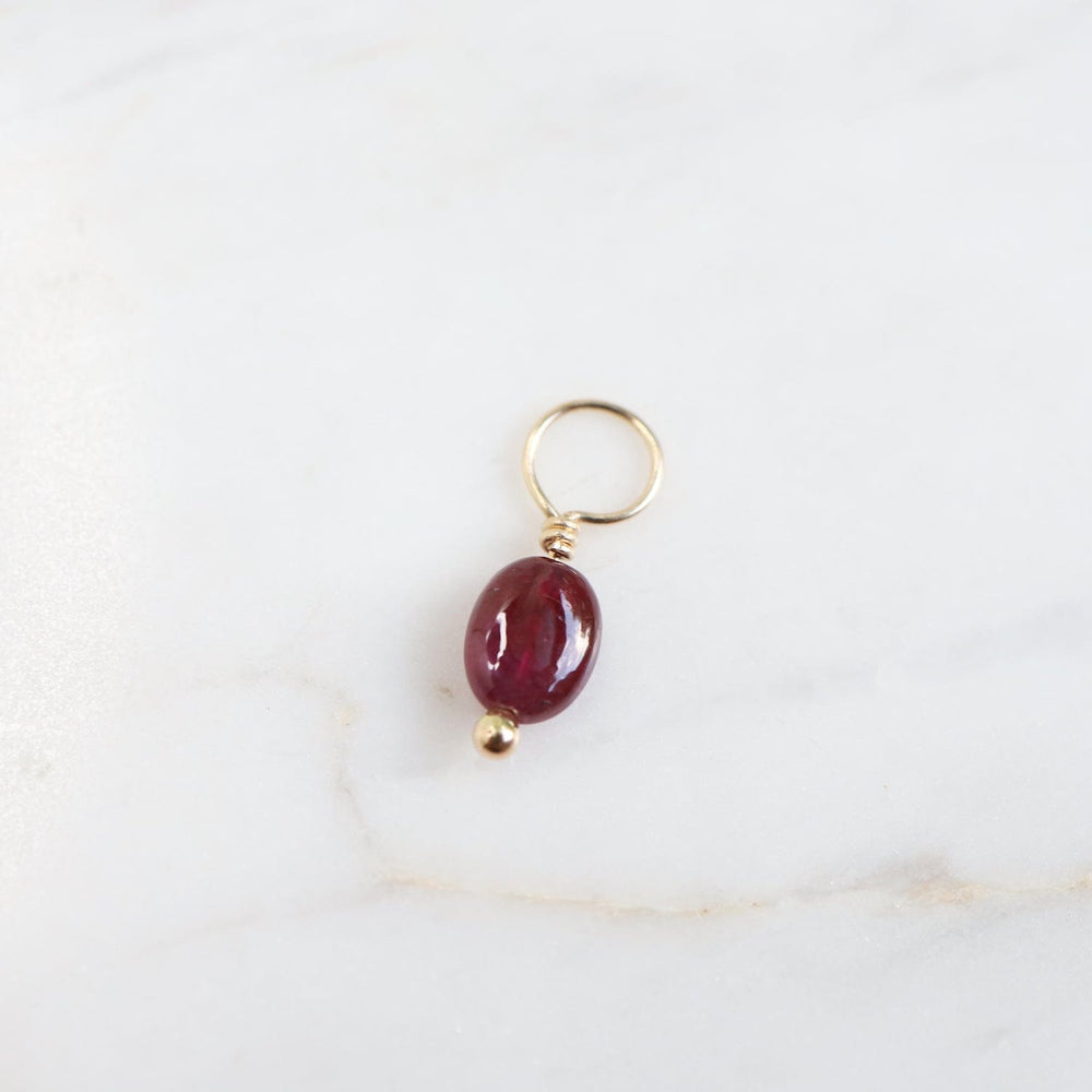 CHM Ruby Unfaceted Oval Gemstone Charm