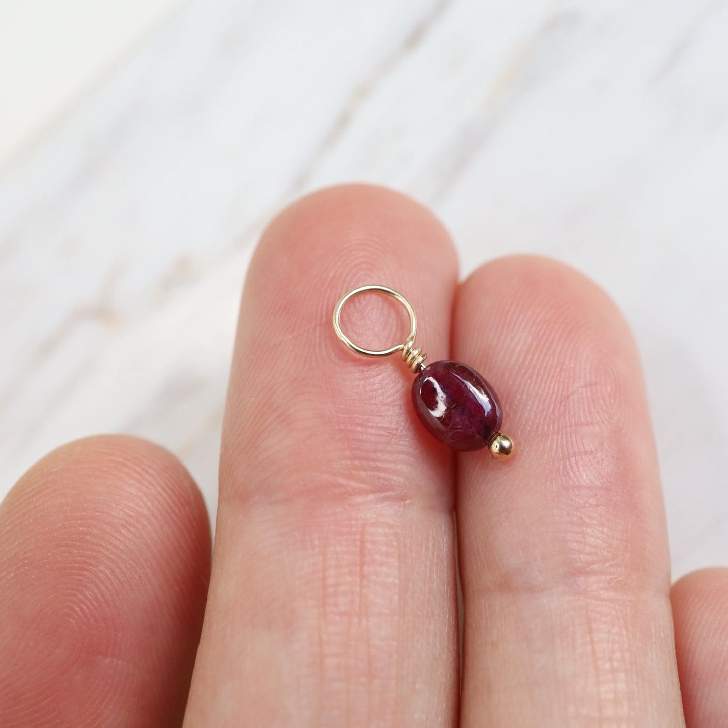 CHM Ruby Unfaceted Oval Gemstone Charm