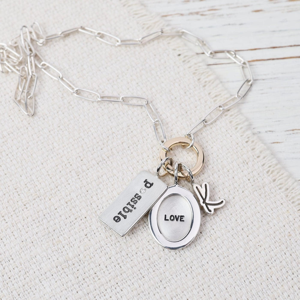 
                  
                    CHM Silver Handwritten Initial Charm
                  
                