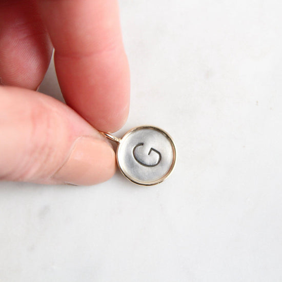 Load image into Gallery viewer, CHM Sterling Silver &amp;quot;G&amp;quot; Round Charm with 14k Gold Frame
