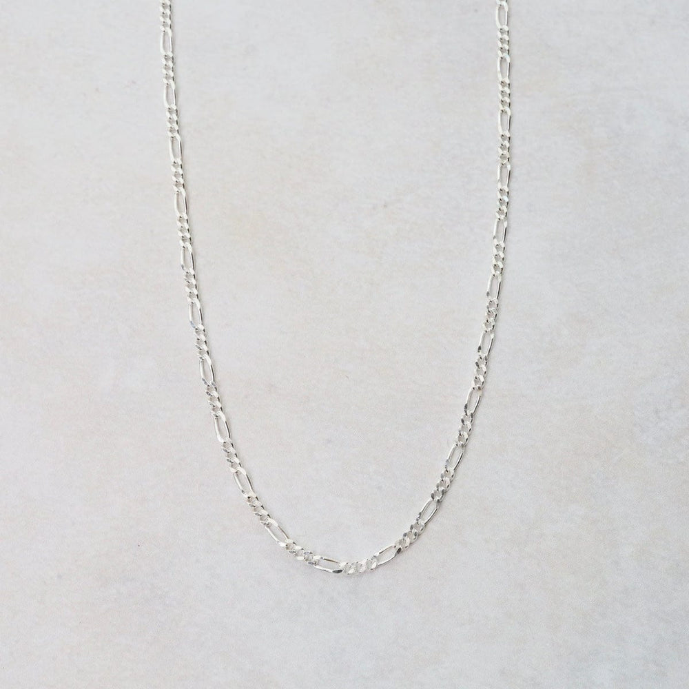 
                      
                        CHN Sterling Silver Figaro Chain - 16"
                      
                    