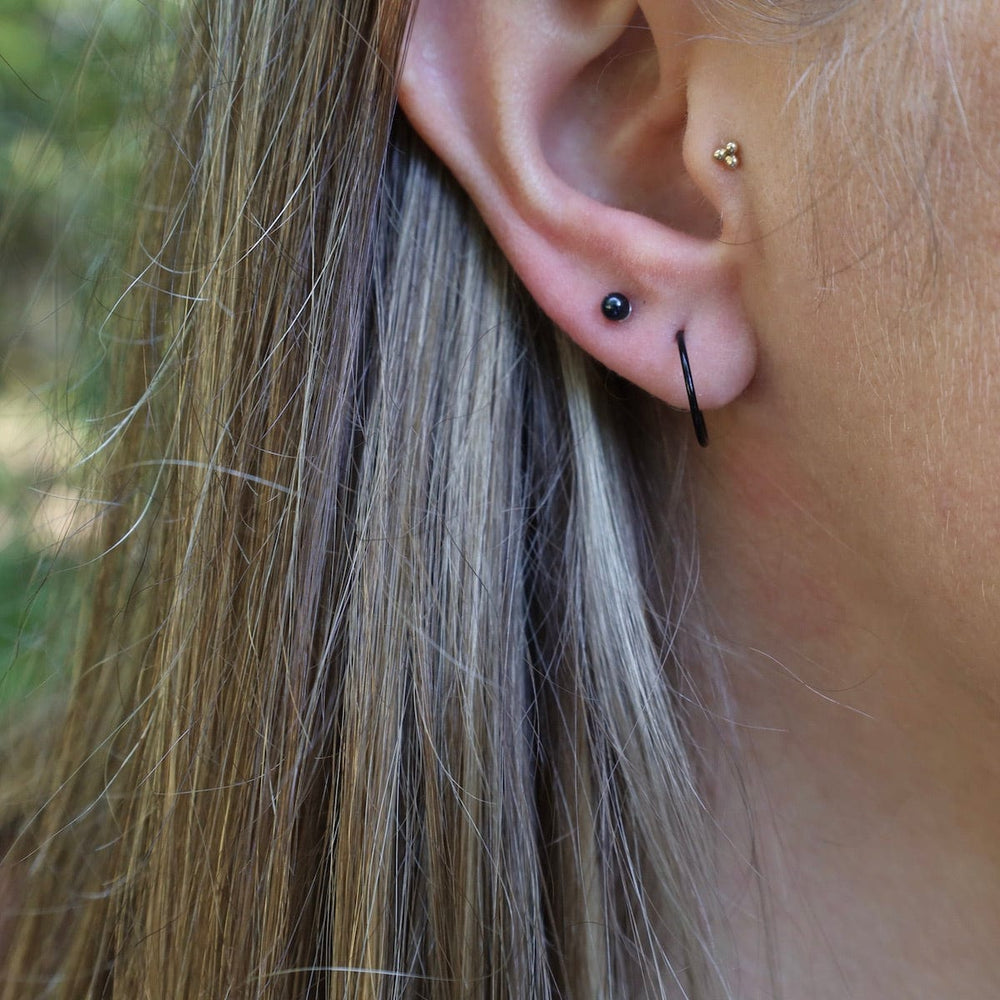 
                      
                        EAR 12mm Black Enamel Sleeper Hoops
                      
                    