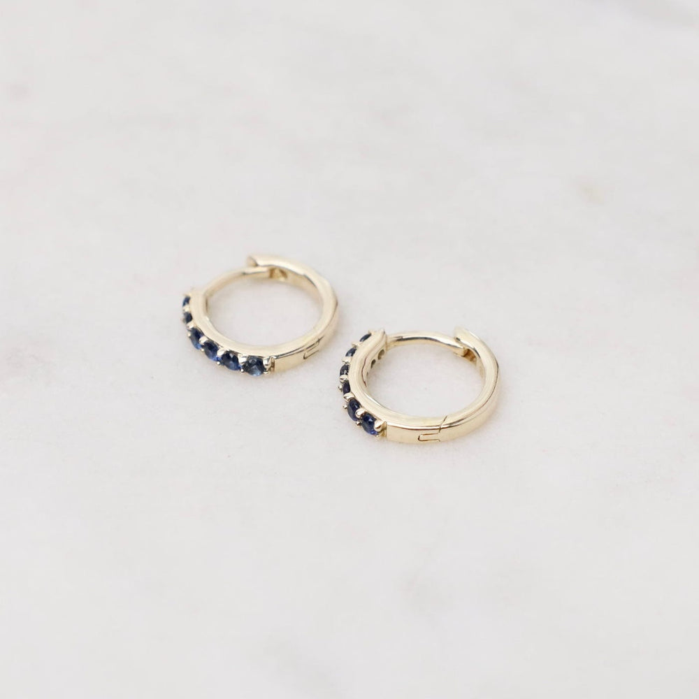 
                      
                        EAR-14K 14k Gold Blue Sapphire Huggies
                      
                    