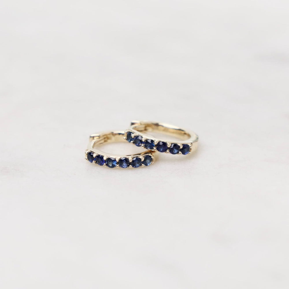 
                      
                        EAR-14K 14k Gold Blue Sapphire Huggies
                      
                    