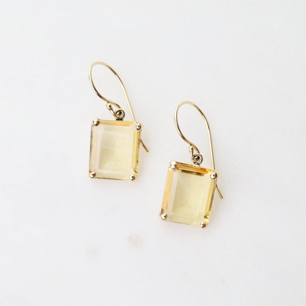 
                      
                        EAR-14K 14K Gold Earrings with Small Emerald Cut Citrine in Prongs
                      
                    