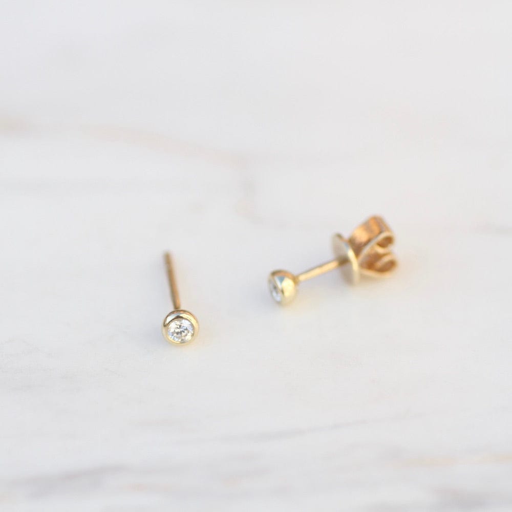 
                      
                        EAR-14K 14K Gold Tiny Bezel Set Diamond Post Earring
                      
                    