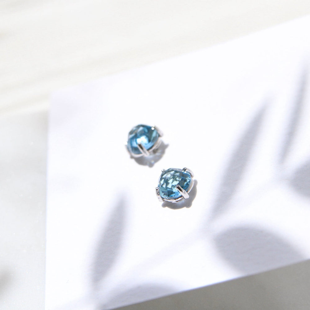 
                  
                    EAR-14K 14k White Gold Round Swiss Blue Topaz Post Earring
                  
                