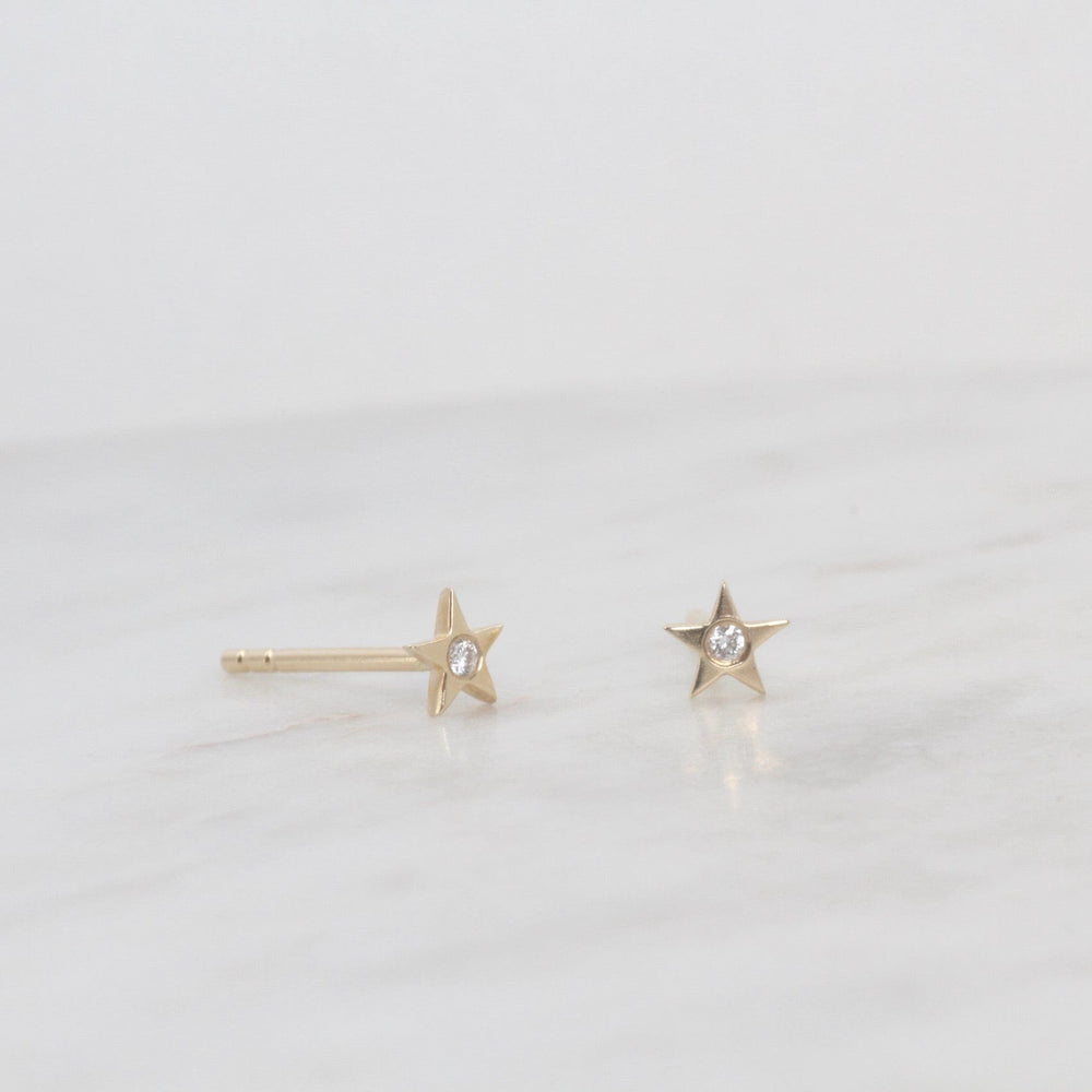 
                      
                        EAR-14K 14k Yellow Gold Brushed Mini Star with Single Diamond
                      
                    