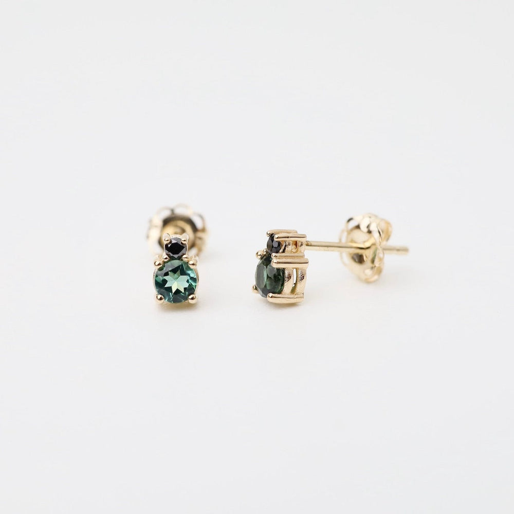 
                      
                        EAR-14K Black Diamond Green Tourmaline Linga Studs
                      
                    