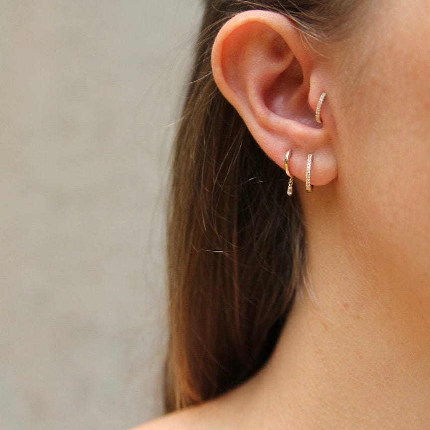 
                      
                        EAR-14K Gold Huggies With Dangling Baguette Diamonds
                      
                    