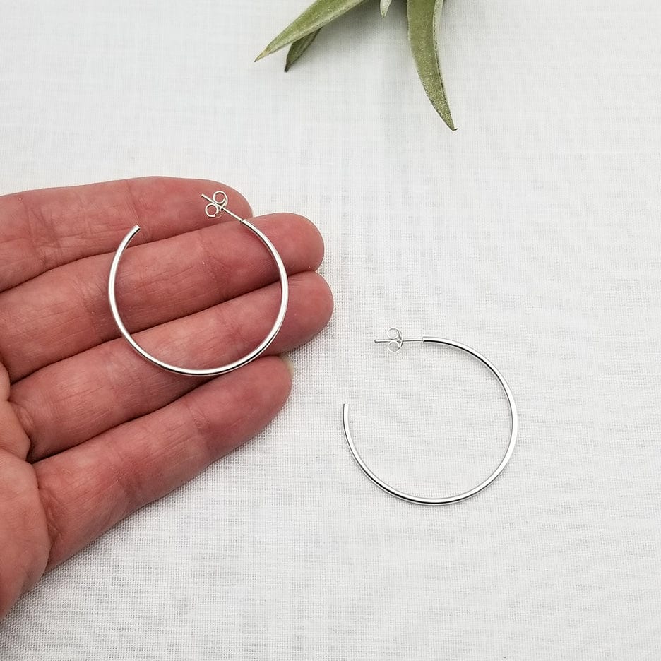 
                      
                        EAR 20mm STERLING SILVER HOOP
                      
                    