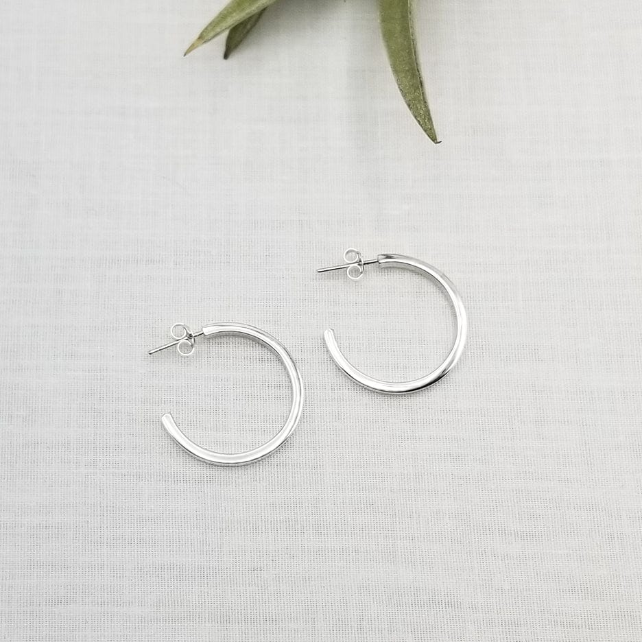 
                      
                        EAR 25mm STERLING SILVER SQUARE TUBE HOOPS
                      
                    