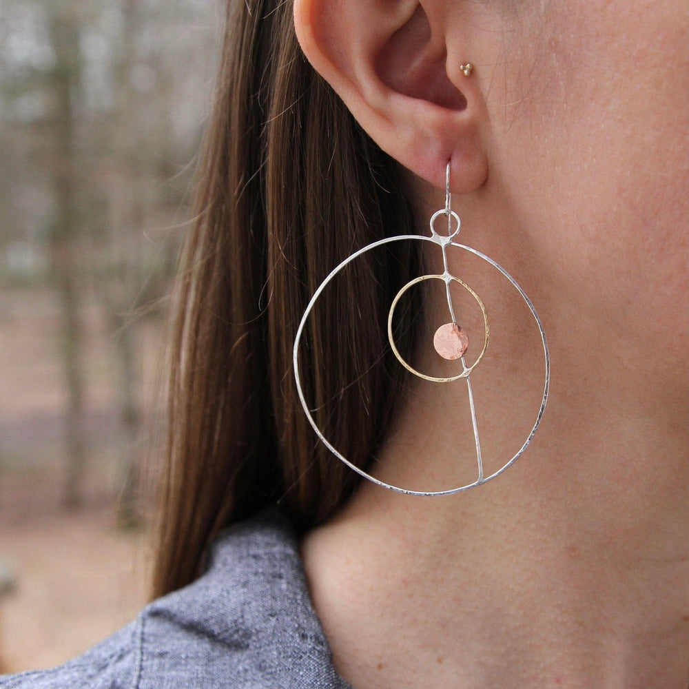 
                  
                    EAR Asymmetrical Silver & Brass Rings Earring
                  
                