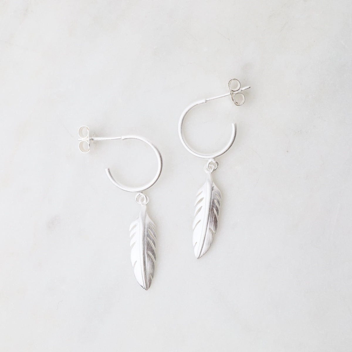 EAR Brushed Sterling Silver Hoops With Feathers