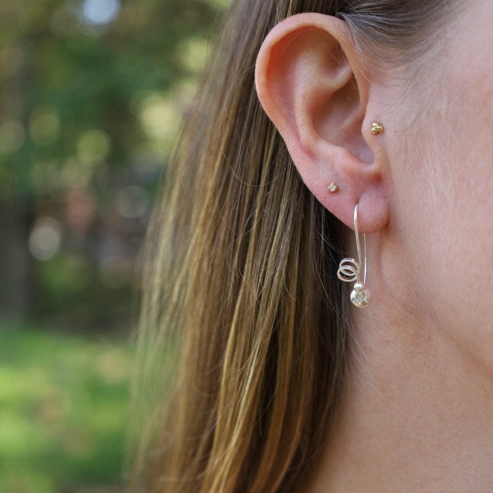 
                      
                        EAR Coil with Balls Pass Through Hoop Earrings
                      
                    