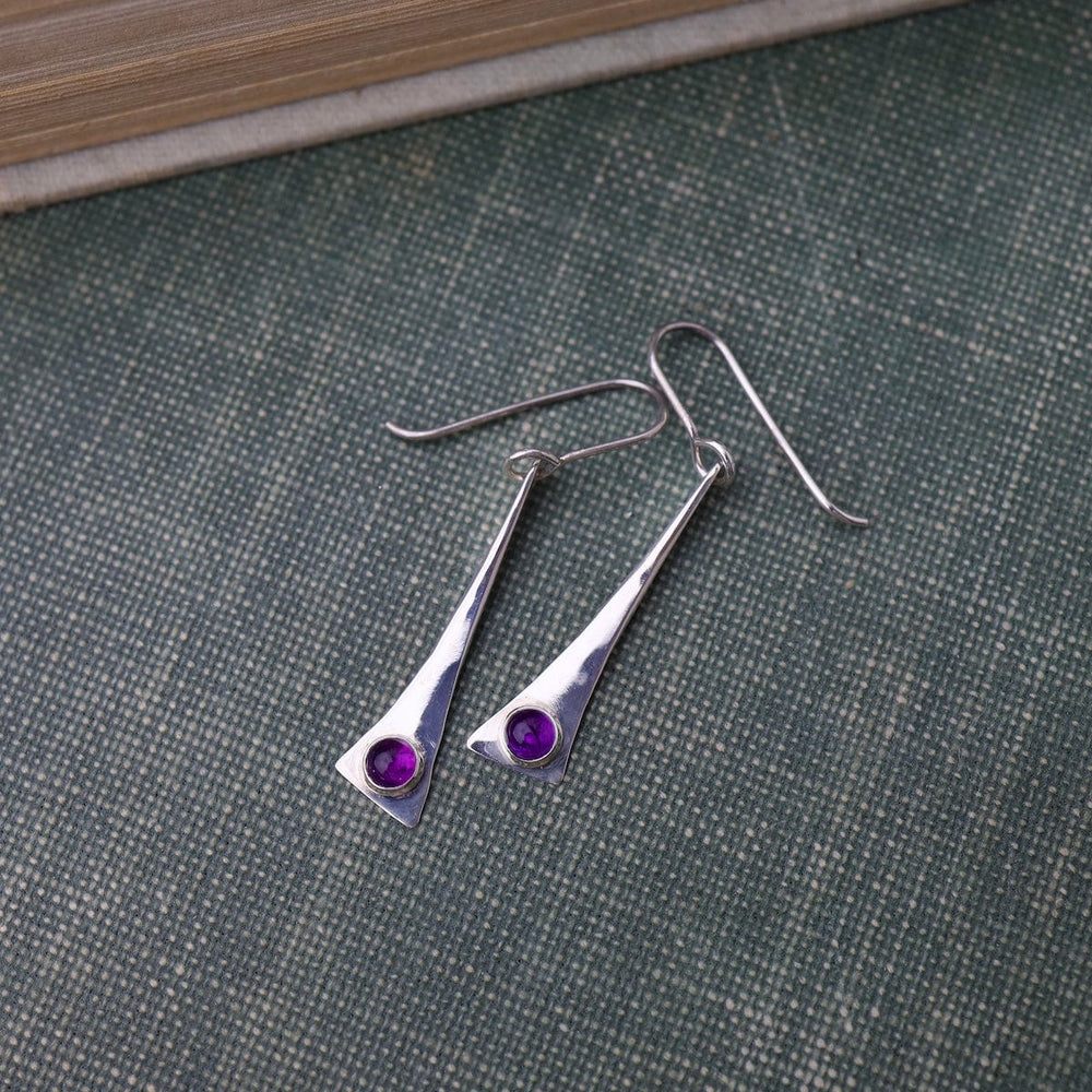 
                      
                        EAR ELONGATED TRIANGLE EARRING W/ AMETHYST CAB
                      
                    