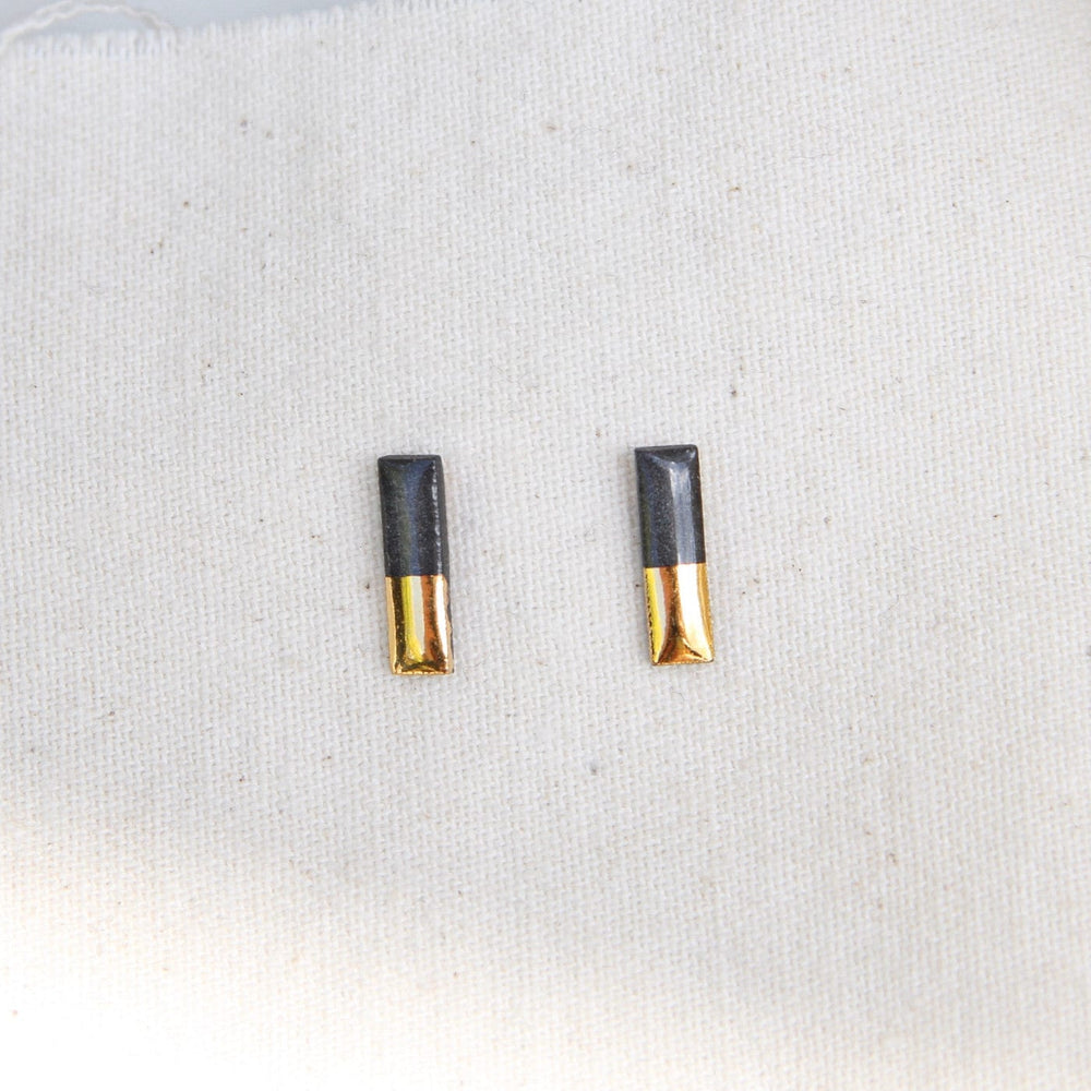 
                      
                        EAR-GF Black Gold Dipped Bar Studs
                      
                    