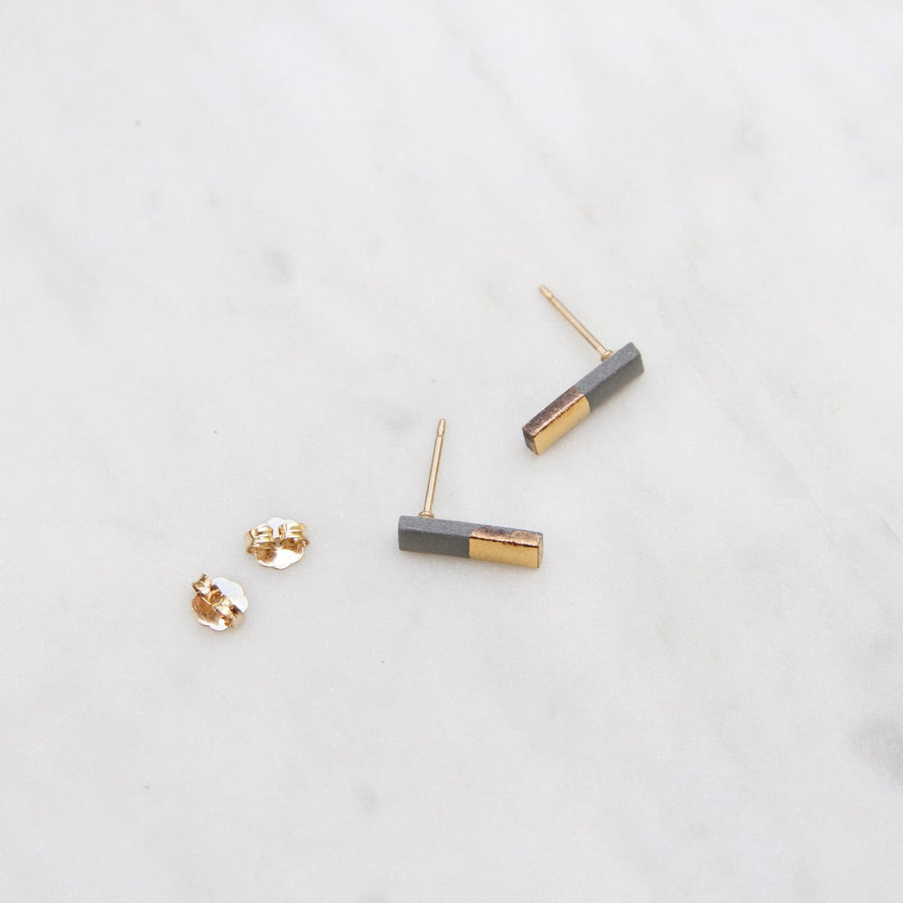 
                      
                        EAR-GF Grey Gold Dipped Bar Studs
                      
                    