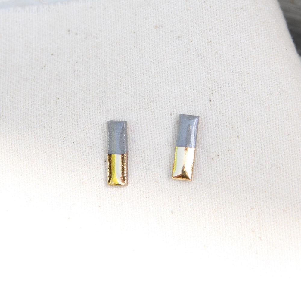 
                      
                        EAR-GF Grey Gold Dipped Bar Studs
                      
                    