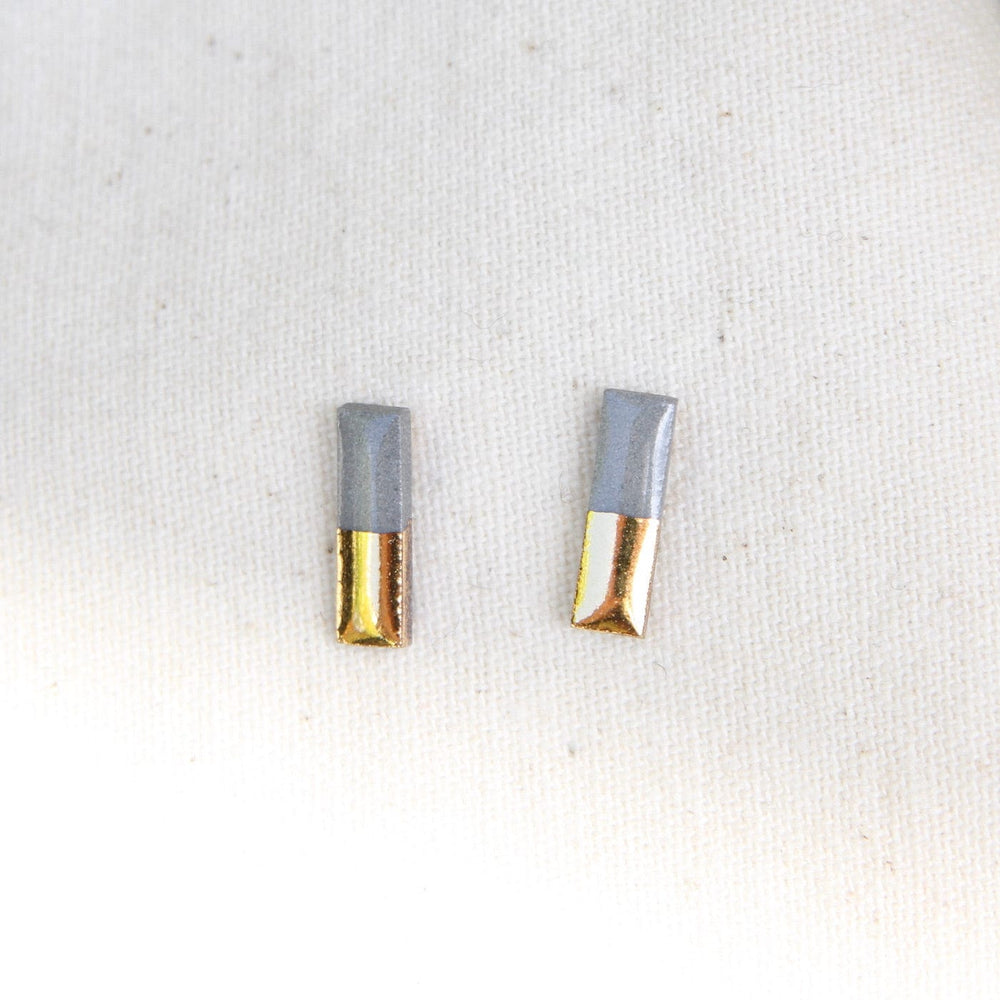 
                      
                        EAR-GF Grey Gold Dipped Bar Studs
                      
                    