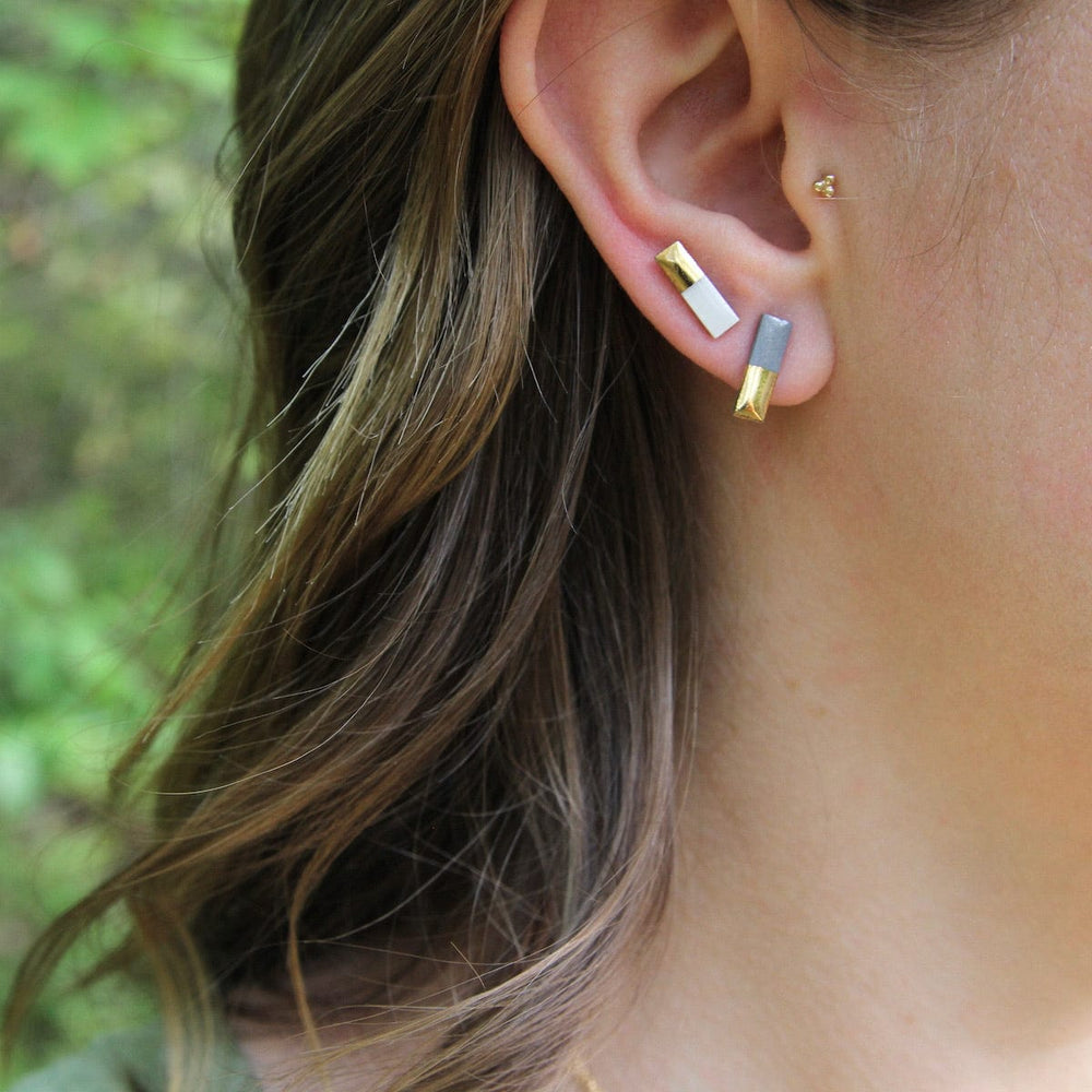 
                      
                        EAR-GF Grey Gold Dipped Bar Studs
                      
                    